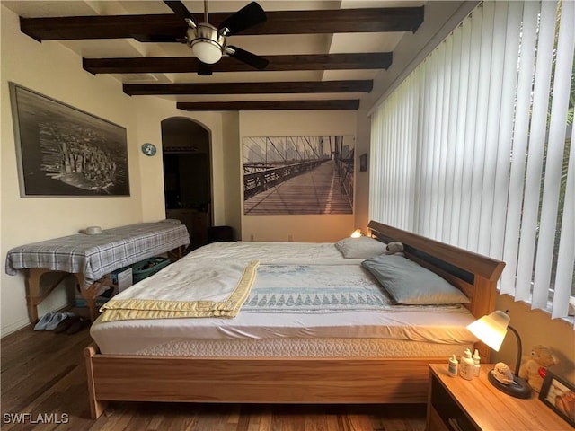 10551 Deal Rd, North Fort Myers, FL 33917 - bedroom with beamed ceiling, wood finished floors, arched walkways, and baseboards