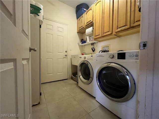 10551 Deal Rd, North Fort Myers, FL 33917 - laundry room featuring washer and dryer, cabinet space, and light tile patterned floors