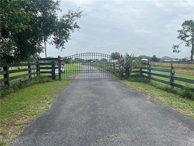 10551 Deal Rd, North Fort Myers, FL 33917 - gate featuring a view of countryside