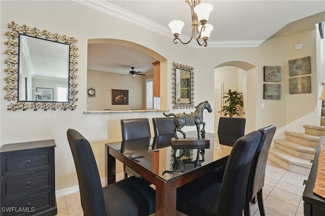 10020 Ravello Blvd, Fort Myers, FL 33905 - dining space featuring arched walkways, light tile patterned floors, a chandelier, crown molding, and a ceiling fan