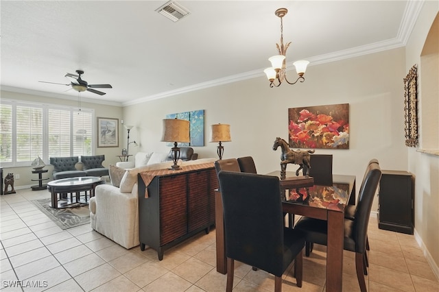 10020 Ravello Blvd, Fort Myers, FL 33905 - dining space featuring light tile patterned floors, a ceiling fan, a chandelier, crown molding, and baseboards
