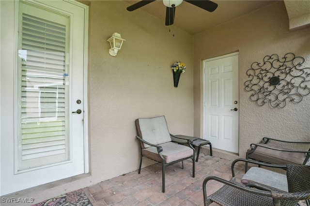 10020 Ravello Blvd, Fort Myers, FL 33905 - doorway to property with stucco siding and ceiling fan