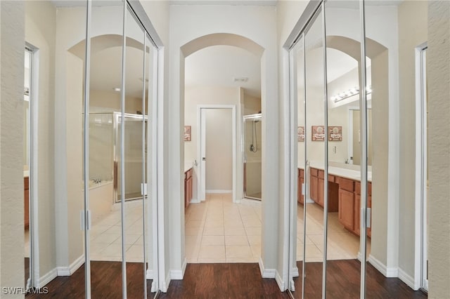 10020 Ravello Blvd, Fort Myers, FL 33905 - corridor featuring arched walkways and wood finished floors
