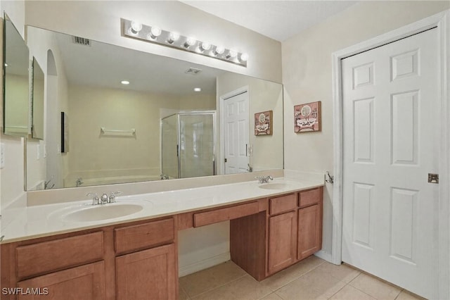 10020 Ravello Blvd, Fort Myers, FL 33905 - bathroom featuring a shower stall, double vanity, tile patterned floors, and a bath