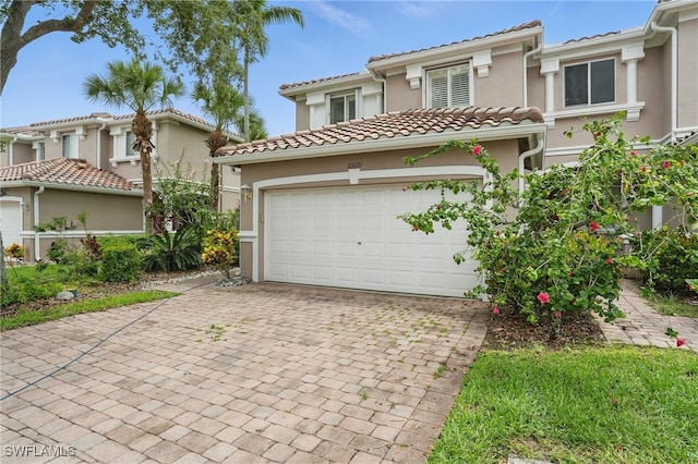 10020 Ravello Blvd, Fort Myers, FL 33905 - mediterranean / spanish-style house with stucco siding, decorative driveway, and a tile roof