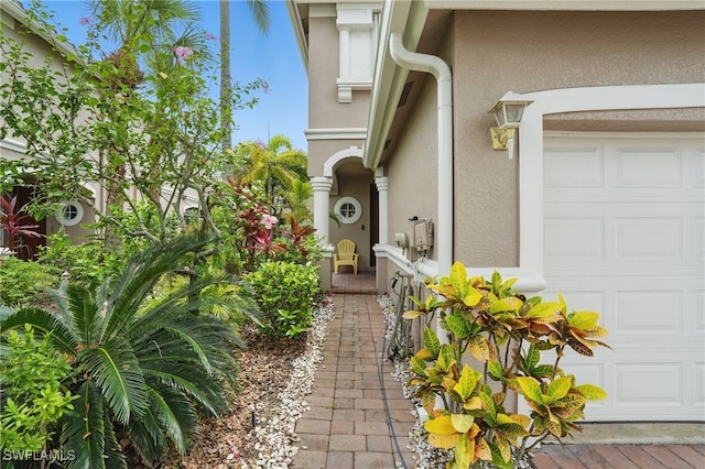 10020 Ravello Blvd, Fort Myers, FL 33905 - property entrance featuring stucco siding and an attached garage