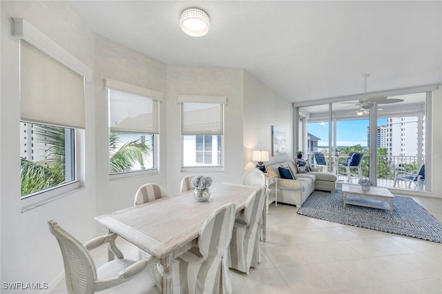 460 Launch Cir Ph 01, Naples, FL 34108 - dining area with healthy amount of natural light, a ceiling fan, and light tile patterned flooring