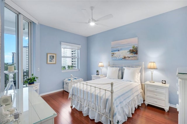 460 Launch Cir Ph 01, Naples, FL 34108 - bedroom featuring dark wood finished floors, baseboards, and a ceiling fan
