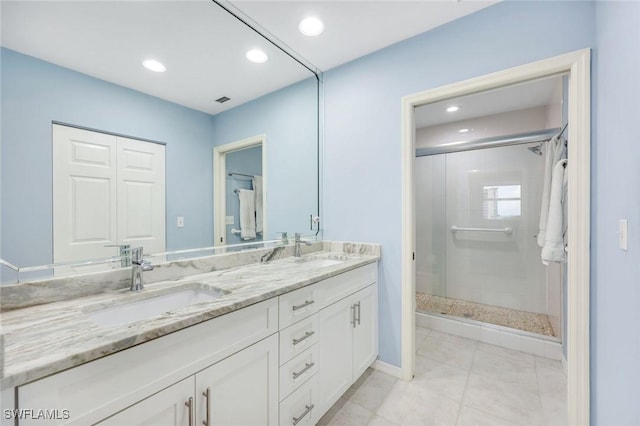 460 Launch Cir Ph 01, Naples, FL 34108 - full bathroom featuring double vanity, recessed lighting, a shower stall, and baseboards