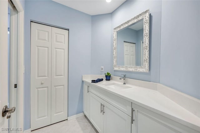 460 Launch Cir Ph 01, Naples, FL 34108 - bathroom with vanity, a closet, and baseboards