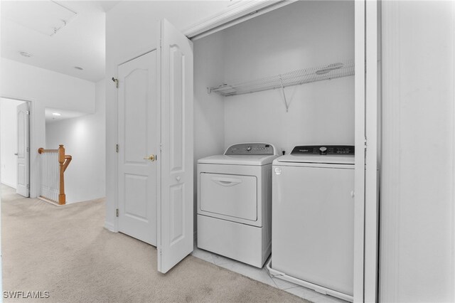 4381 Lazio Way Unit 501, Fort Myers, FL 33901 - laundry area with washer and clothes dryer and light colored carpet