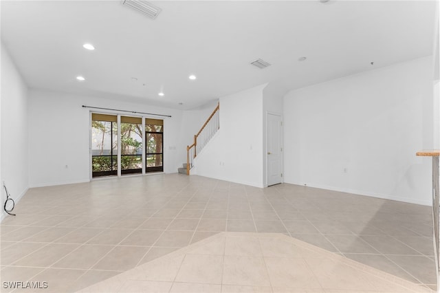 4381 Lazio Way Unit 501, Fort Myers, FL 33901 - spare room featuring recessed lighting, stairway, baseboards, and light tile patterned flooring