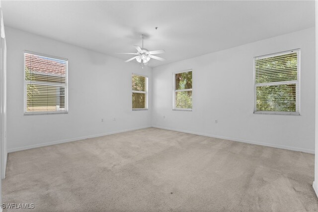 4381 Lazio Way Unit 501, Fort Myers, FL 33901 - spare room with ceiling fan, baseboards, and light colored carpet