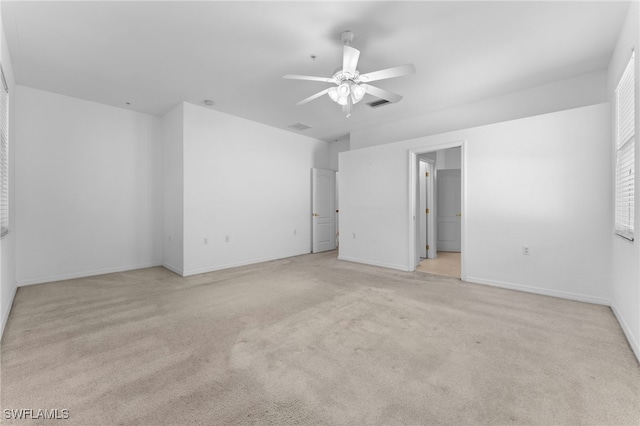 4381 Lazio Way Unit 501, Fort Myers, FL 33901 - empty room with light colored carpet, a ceiling fan, and baseboards