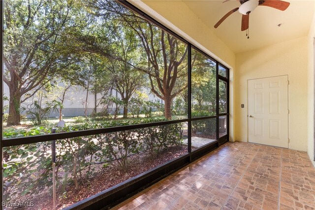 4381 Lazio Way Unit 501, Fort Myers, FL 33901 - unfurnished sunroom featuring lofted ceiling