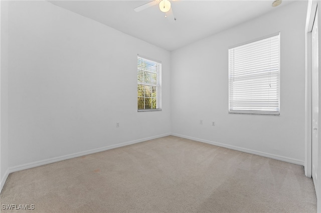 4381 Lazio Way Unit 501, Fort Myers, FL 33901 - spare room featuring light carpet, a ceiling fan, and baseboards