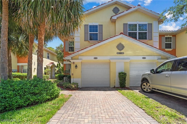 4381 Lazio Way Unit 501, Fort Myers, FL 33901 - multi unit property with stucco siding, decorative driveway, and an attached garage