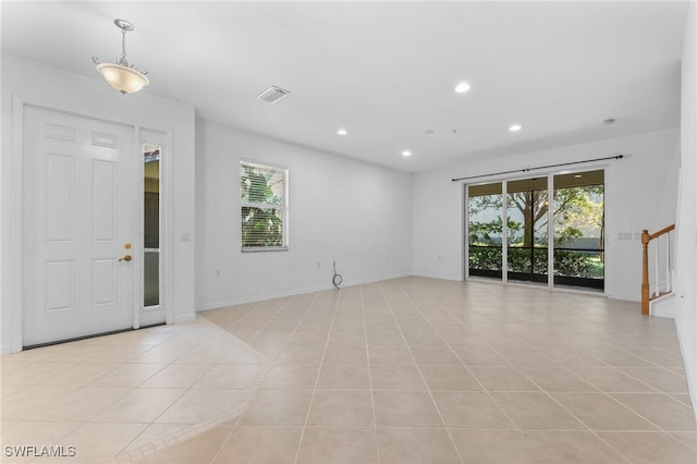 4381 Lazio Way Unit 501, Fort Myers, FL 33901 - entryway with healthy amount of natural light, light tile patterned floors, recessed lighting, and baseboards