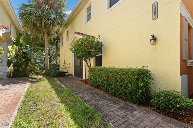 4381 Lazio Way Unit 501, Fort Myers, FL 33901 - view of property exterior featuring stucco siding