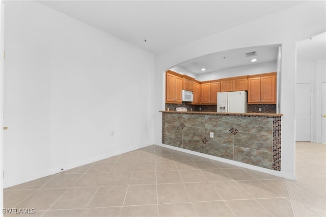 4381 Lazio Way Unit 501, Fort Myers, FL 33901 - kitchen featuring white appliances, recessed lighting, dark countertops, decorative backsplash, and light tile patterned flooring