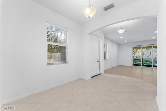 4381 Lazio Way Unit 501, Fort Myers, FL 33901 - empty room featuring arched walkways, recessed lighting, and baseboards