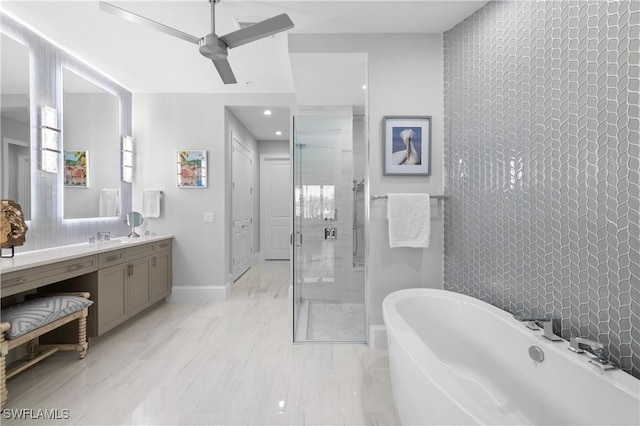 16304 Corsica Way Unit 101, Naples, FL 34110 - bathroom featuring a freestanding bath, vanity, a stall shower, a ceiling fan, and backsplash