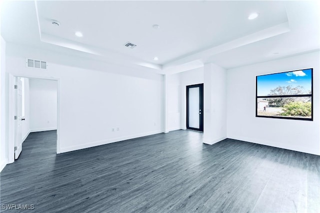 352 Rawlings Ave, Lehigh Acres, FL 33974 - unfurnished room featuring a raised ceiling, dark wood-type flooring, and recessed lighting