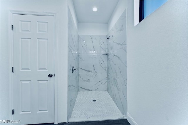 352 Rawlings Ave, Lehigh Acres, FL 33974 - bathroom featuring a marble finish shower, recessed lighting, and baseboards