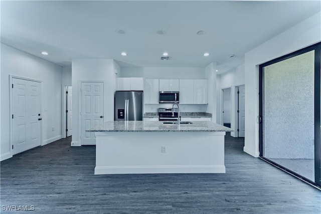 352 Rawlings Ave, Lehigh Acres, FL 33974 - kitchen featuring appliances with stainless steel finishes, a sink, white cabinetry, a kitchen island with sink, and dark wood-type flooring