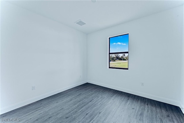 352 Rawlings Ave, Lehigh Acres, FL 33974 - unfurnished room featuring dark wood-style flooring and baseboards