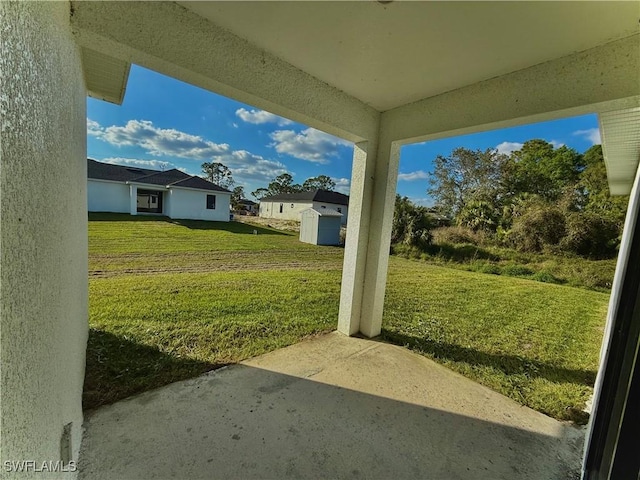 352 Rawlings Ave, Lehigh Acres, FL 33974 - view of grassy yard with a patio area