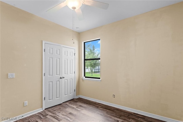 2211 SW 12th Ln, Cape Coral, FL 33991 - unfurnished bedroom featuring wood finished floors, a closet, and a ceiling fan