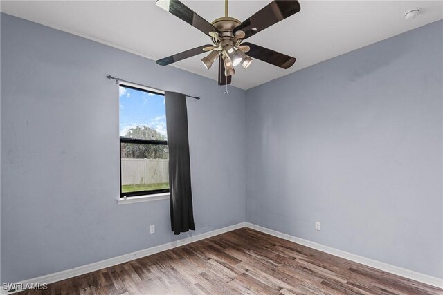 2211 SW 12th Ln, Cape Coral, FL 33991 - spare room with wood finished floors, a smoke detector, and a ceiling fan