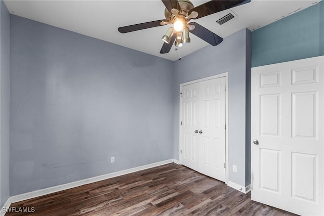 2211 SW 12th Ln, Cape Coral, FL 33991 - unfurnished bedroom featuring dark wood finished floors, a closet, and ceiling fan
