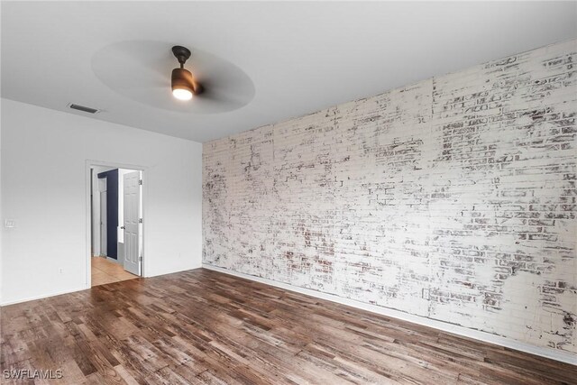 2211 SW 12th Ln, Cape Coral, FL 33991 - empty room with a ceiling fan and wood finished floors