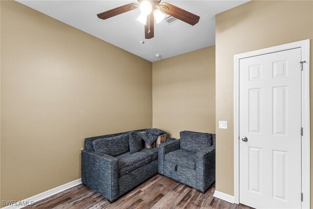 2211 SW 12th Ln, Cape Coral, FL 33991 - living area featuring a ceiling fan and wood finished floors