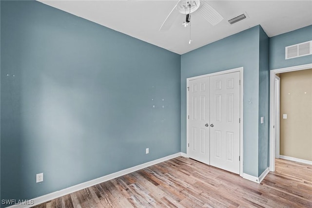 2211 SW 12th Ln, Cape Coral, FL 33991 - unfurnished bedroom featuring wood finished floors, a closet, and a ceiling fan