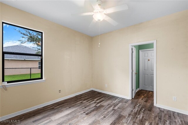 2211 SW 12th Ln, Cape Coral, FL 33991 - empty room featuring wood finished floors and ceiling fan