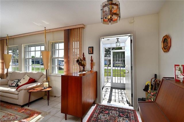 104 Waterview Ave, Lehigh Acres, FL 33936 - tiled foyer entrance featuring a chandelier