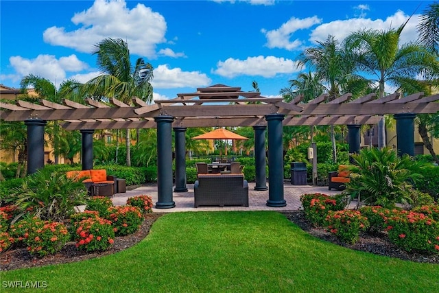 9065 Albion Ln N Unit 4909, Naples, FL 34113 - view of community with a pergola, a yard, and a patio