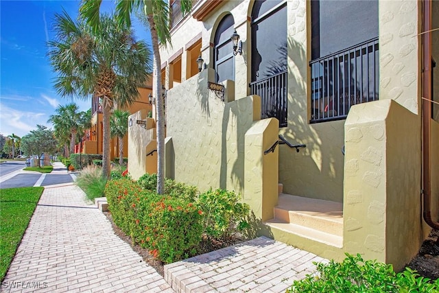 9065 Albion Ln N Unit 4909, Naples, FL 34113 - view of side of property with stucco siding