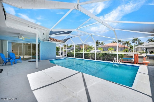 53 Madagascar Ct, Marco Island, FL 34145 - outdoor pool featuring a patio area, ceiling fan, and glass enclosure
