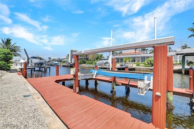 53 Madagascar Ct, Marco Island, FL 34145 - dock area featuring boat lift and a water view