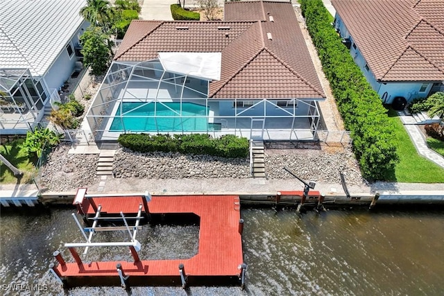 53 Madagascar Ct, Marco Island, FL 34145 - dock area featuring a water view, boat lift, and a lanai