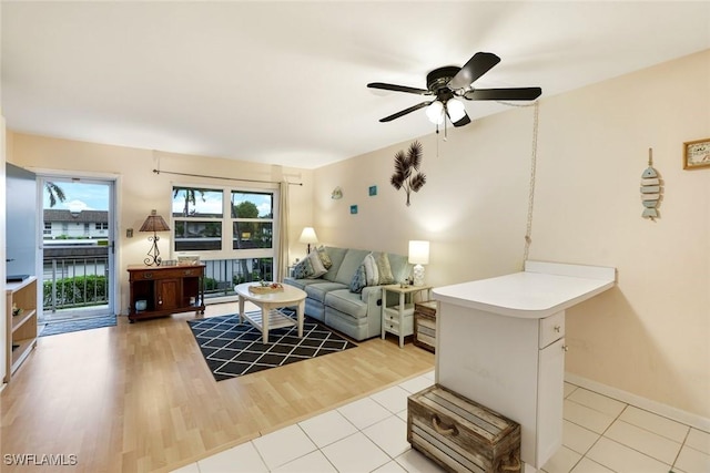 240 N Collier Blvd Unit G8, Marco Island, FL 34145 - living area featuring ceiling fan, light wood finished floors, and baseboards