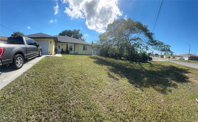 4090 32nd Ave SW, Naples, FL 34116 - single story home with an attached garage, a front lawn, and driveway