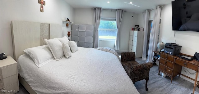 4090 32nd Ave SW, Naples, FL 34116 - bedroom with wood finished floors and recessed lighting