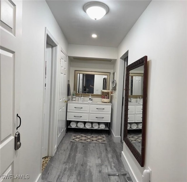 4090 32nd Ave SW, Naples, FL 34116 - bathroom featuring vanity, wood finished floors, and baseboards