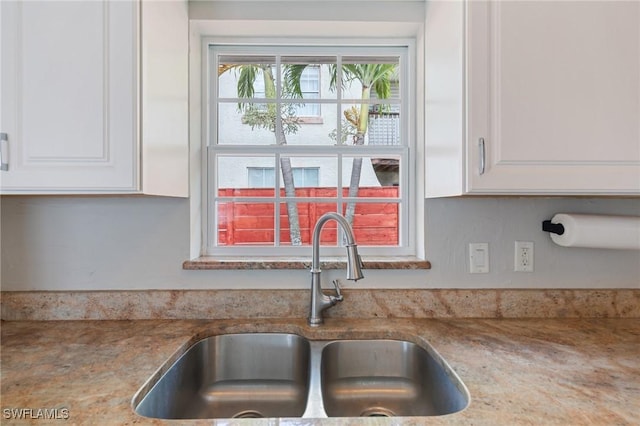 3018 Sunset Rd, Fort Myers, FL 33901 - kitchen featuring white cabinetry and light stone countertops