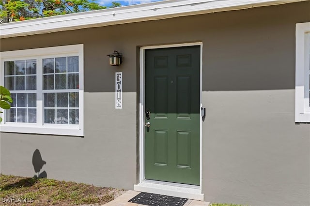3018 Sunset Rd, Fort Myers, FL 33901 - doorway to property with stucco siding